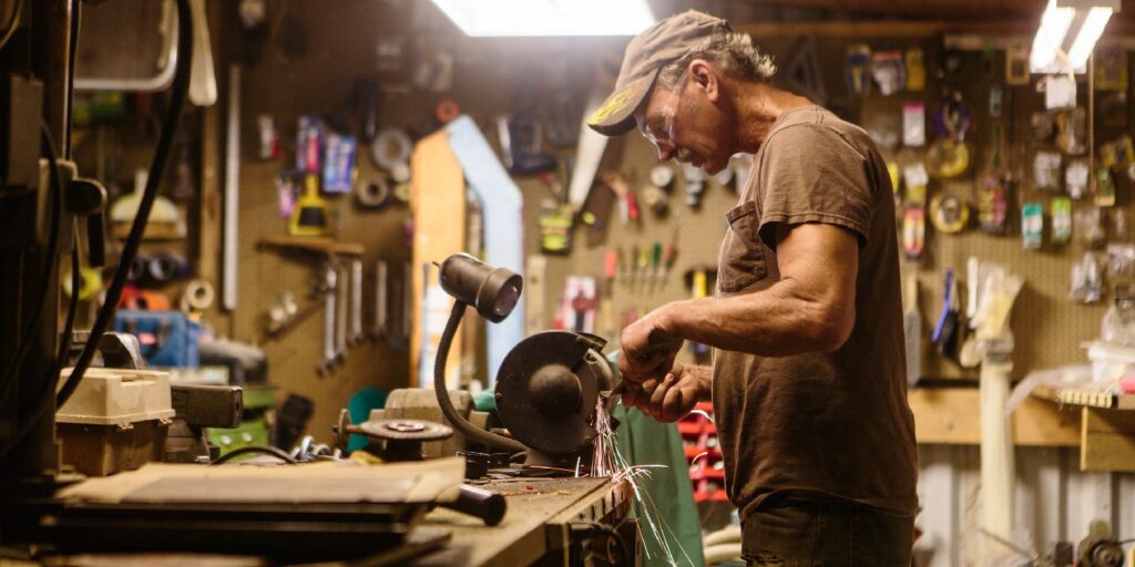 Mechanic working in garage shop