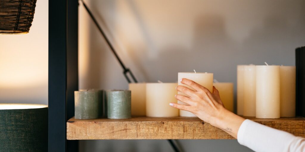 Close Up Photo Of Woman Hands Decorating Her Store