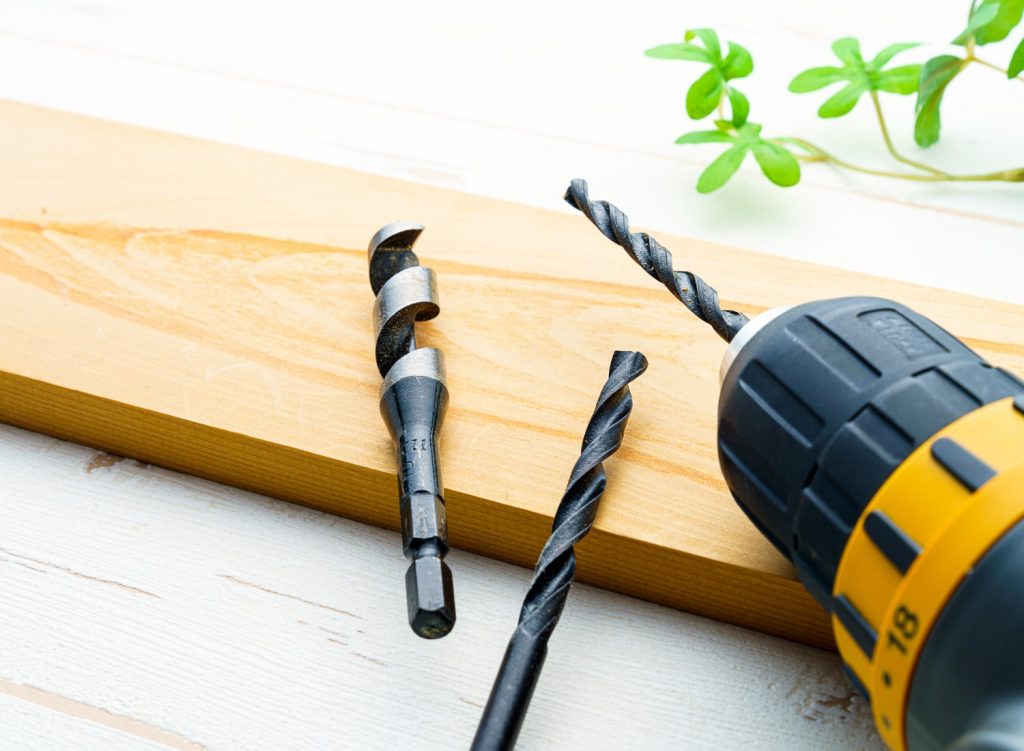 Drill bits on wooden table